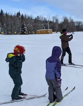 Kids taking a ski lesson